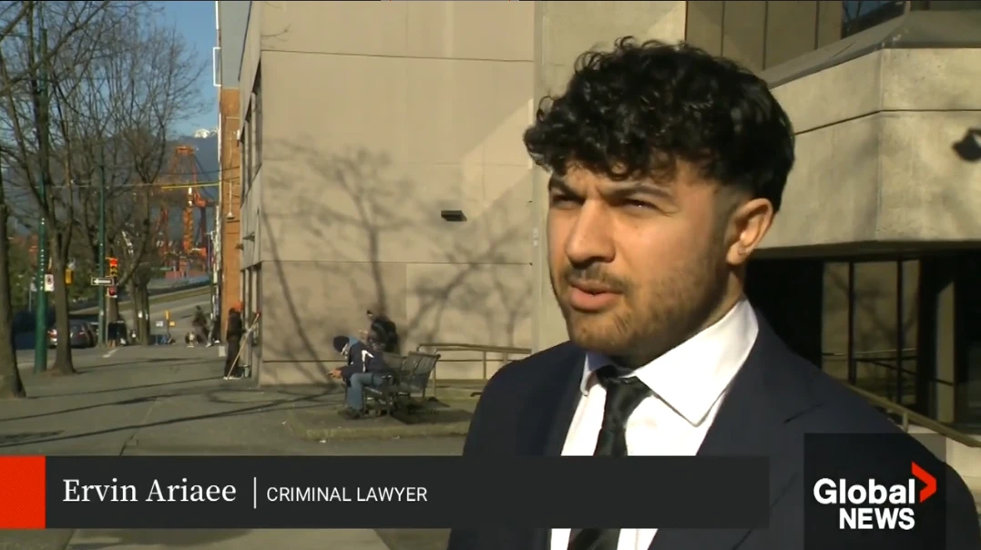 Ervin Ariaee interviewed by Global News outside a Vancouver courthouse